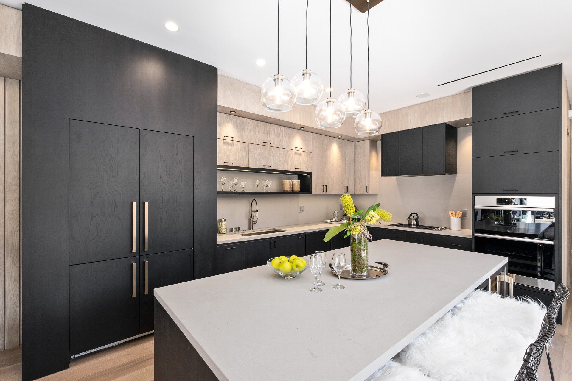 Custom cabinetry and a pale island in an Olive Avenue kitchen