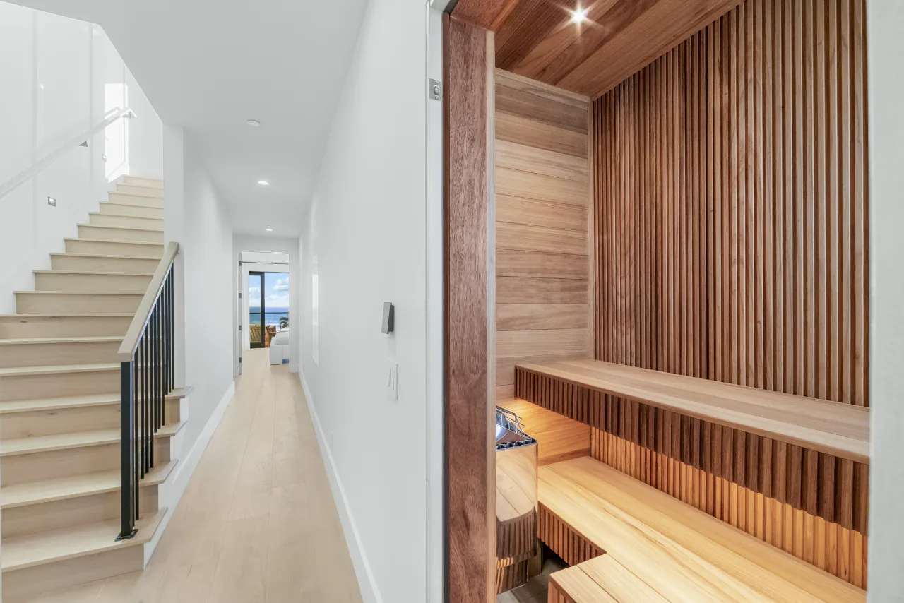 Wood-lined sauna beside the staircase